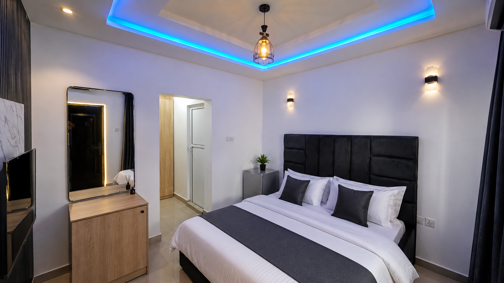 Classic Room king-bed accommodation at Fingers Bar Luxury Apartments in Calabar